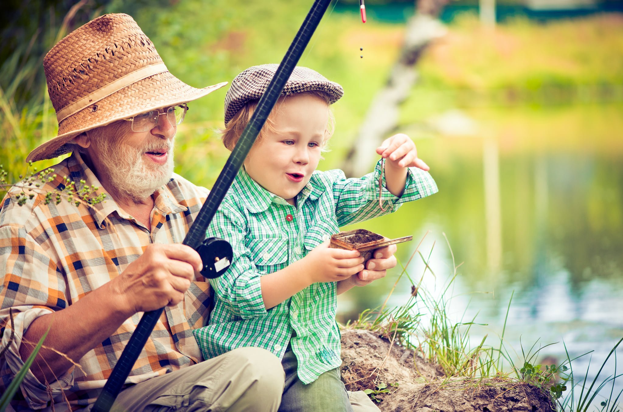 Elderly man and young child fishing