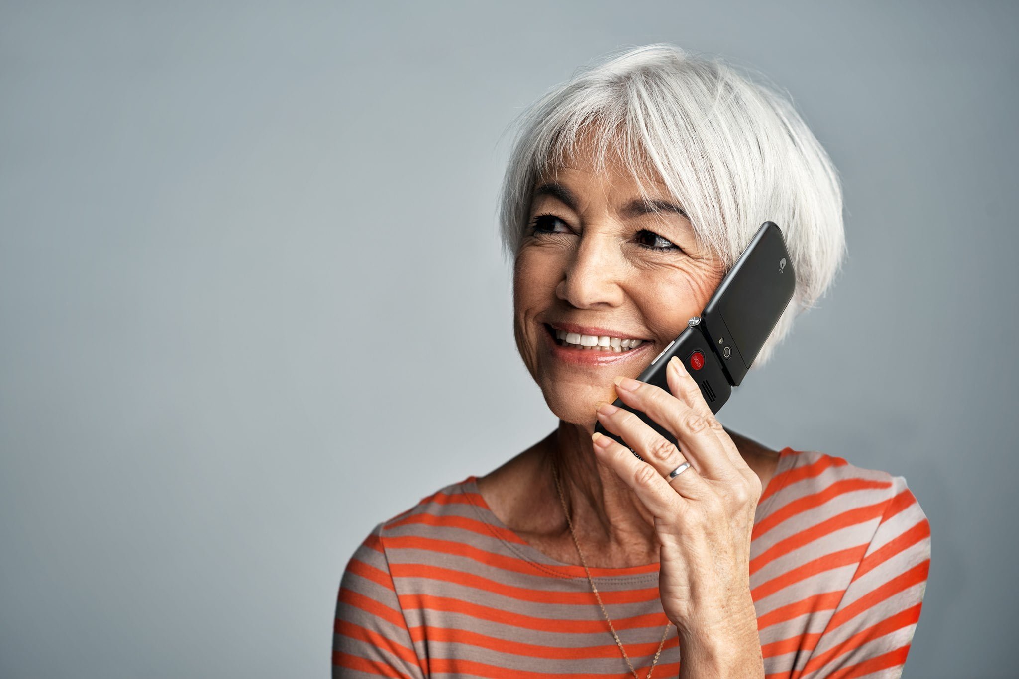 Elderly woman calling on cellphone