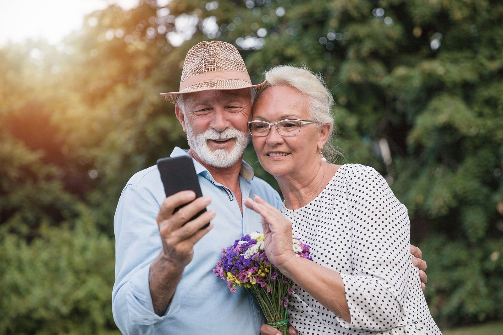 Elderly couple looking at cellphone